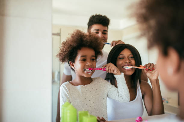 a family observing their oral health care routine
